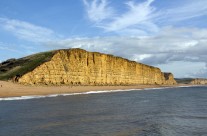 Set against a clear blue sky, the ravages of time… The Jurassic coast at West Bay, Dorset